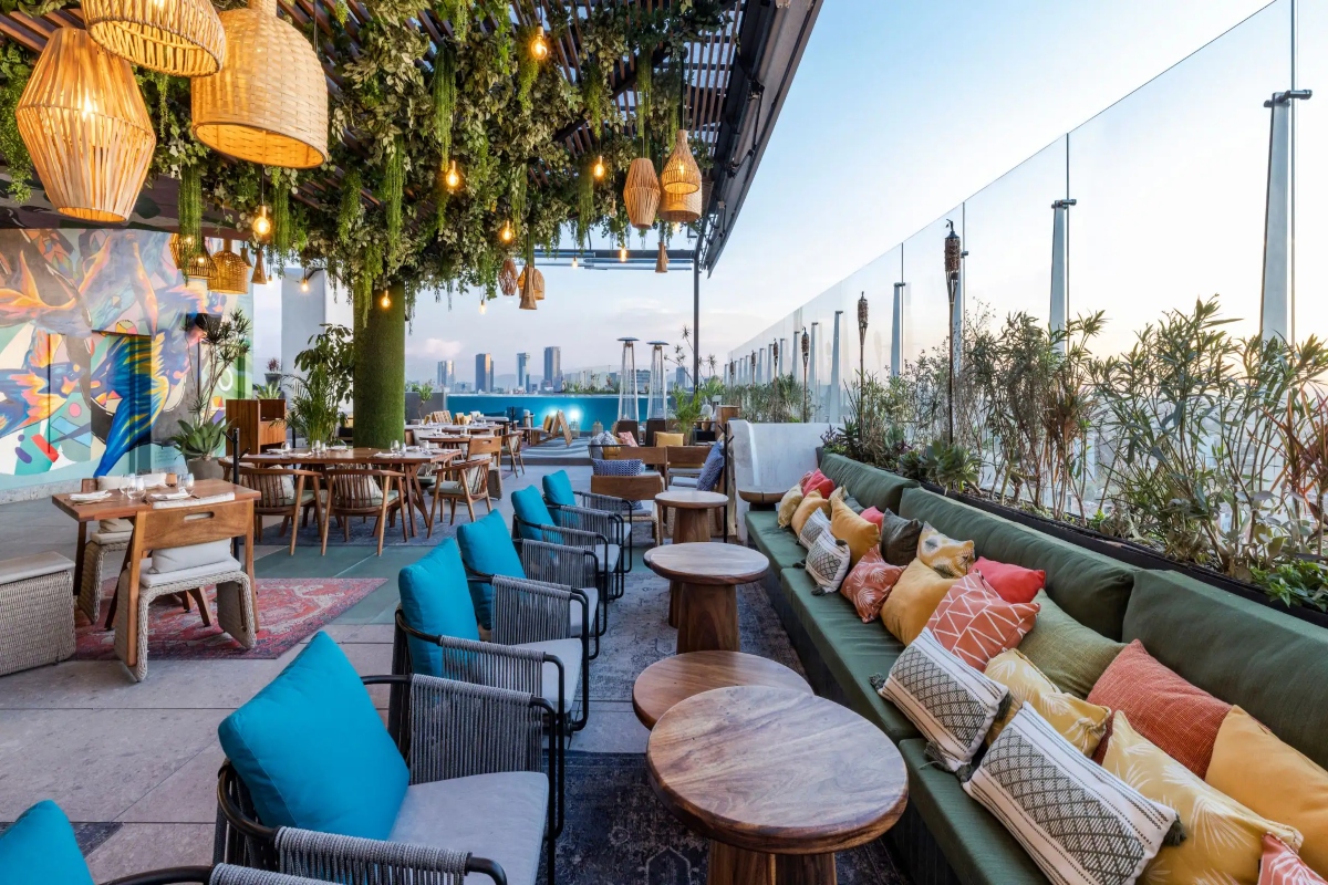 Cabuya rooftop daytime seating area filled with colorful chairs.