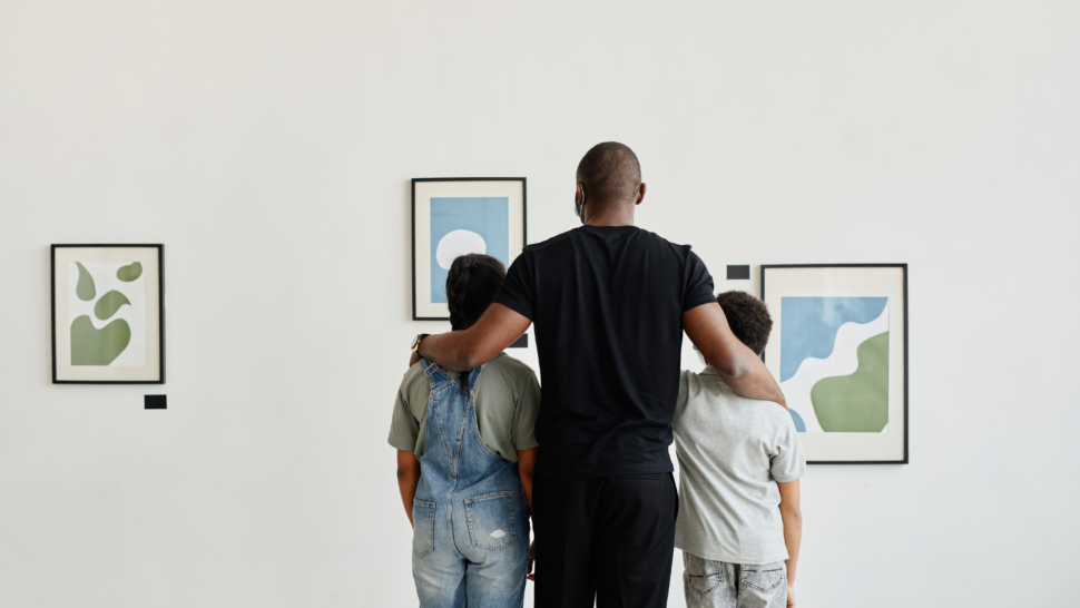 Family visiting art gallery on vacation