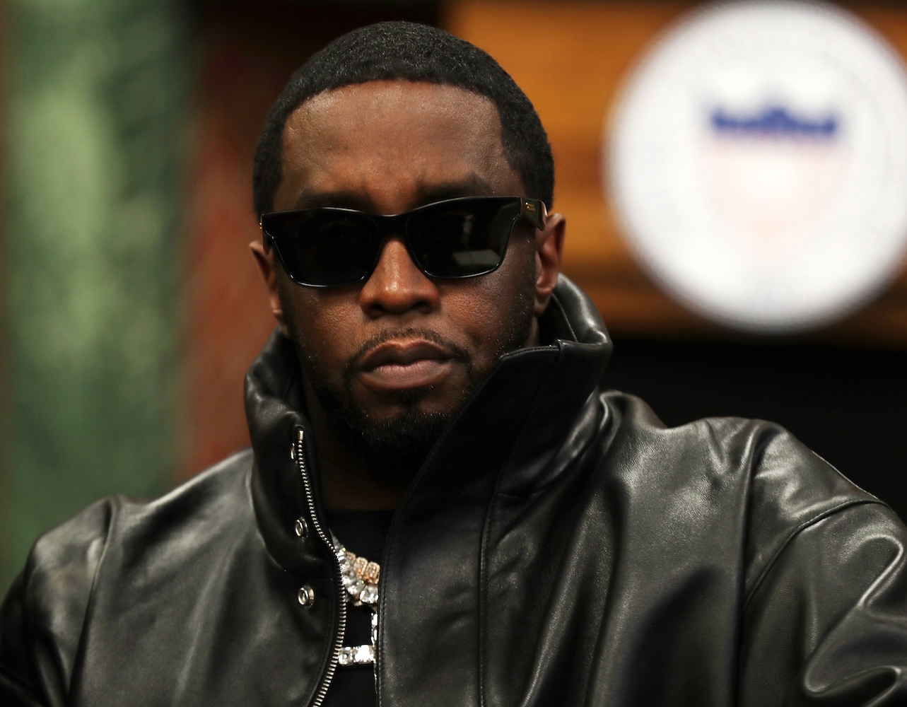 Sean "Diddy" Combs in all black with black shades.