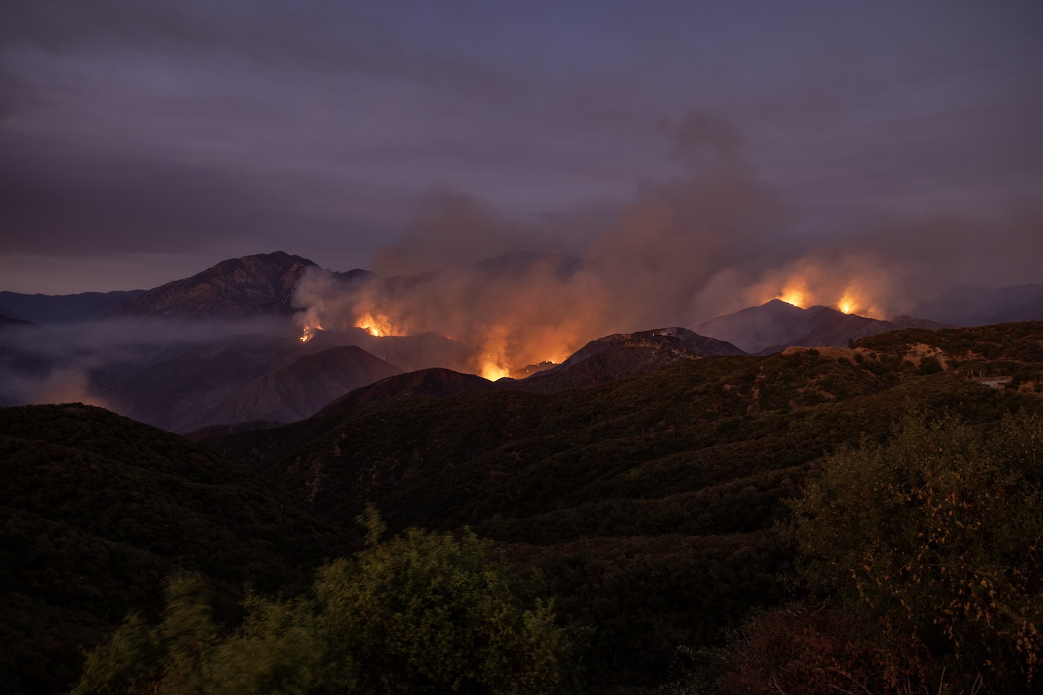 Bridge Fire burns in dark Southern California sky.