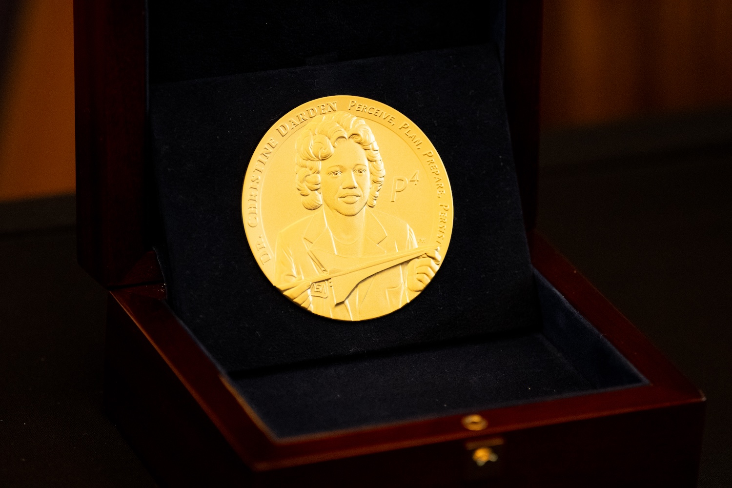 A Congressional Gold Medal for Christine Darden is visible during a ceremony on Capitol Hill.