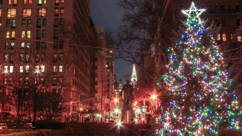 Gramercy neighborhood at night during the holidays with lit up Christmas tree