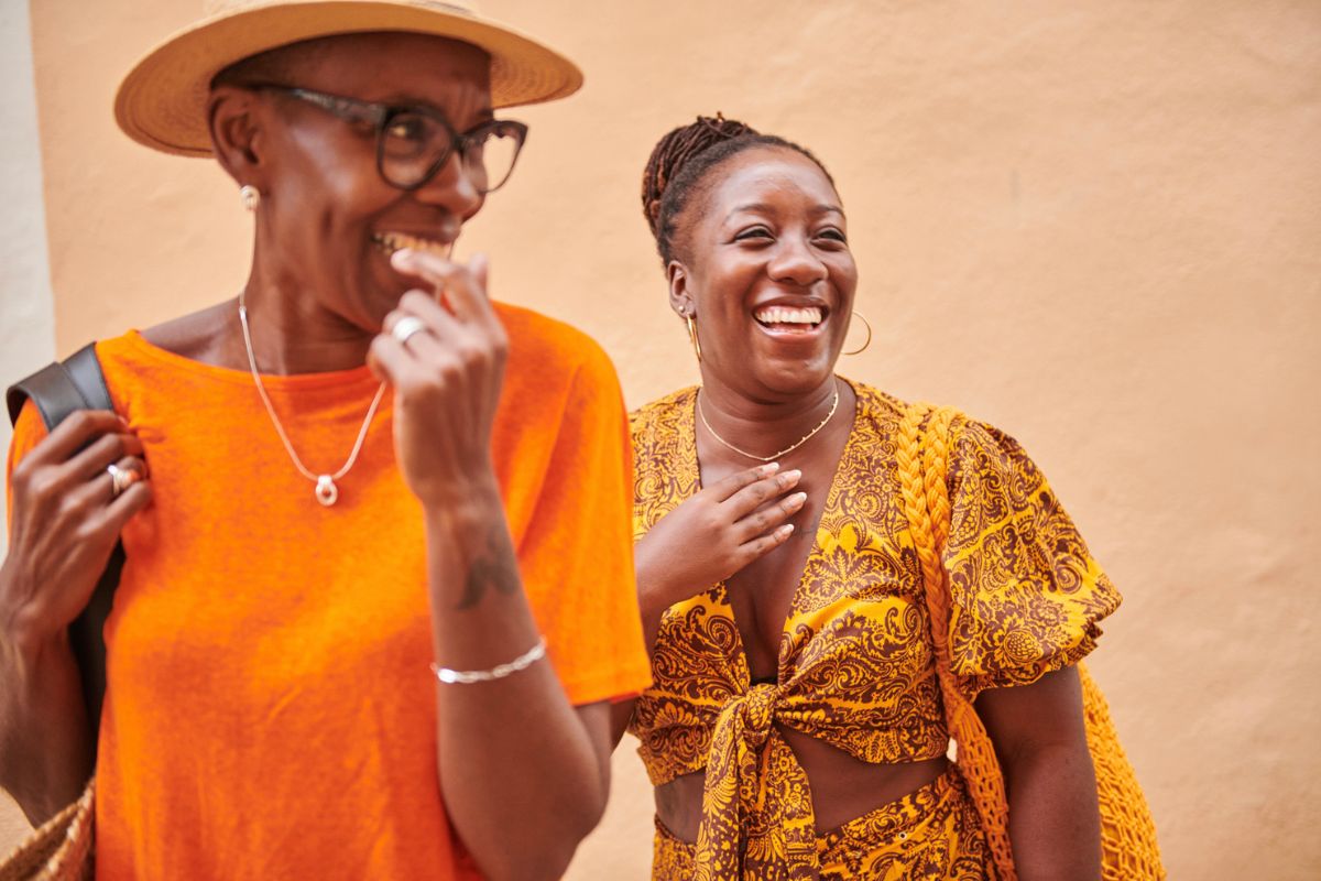 mother and daughter laughing while on vacation