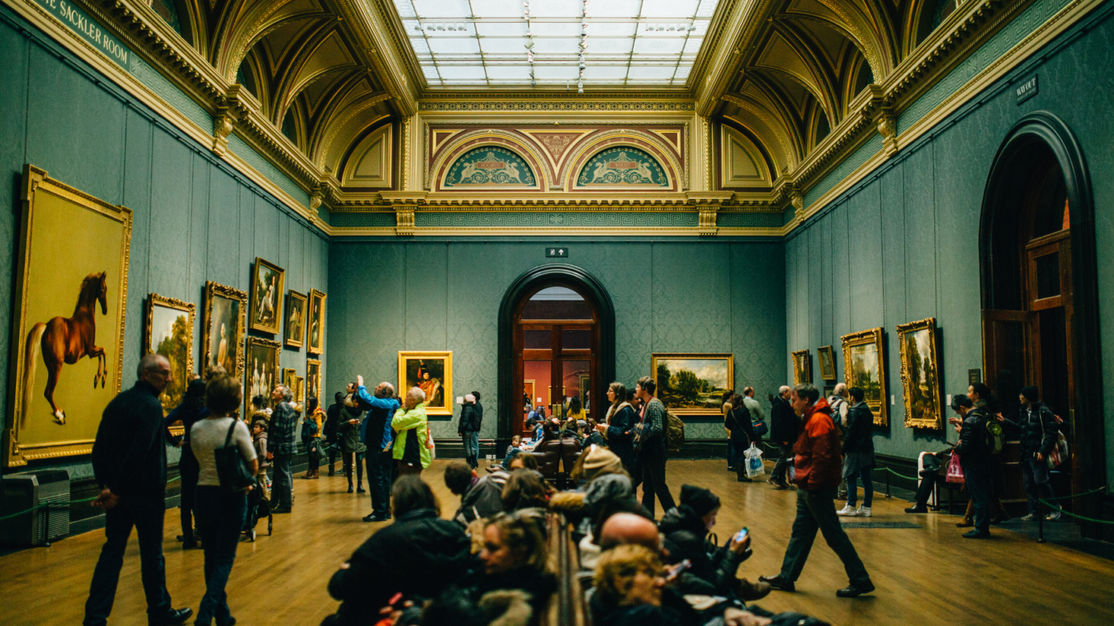 People Walking on Wooden Floor Inside Green Walled Building. Have you been to Europe's most visited museums?