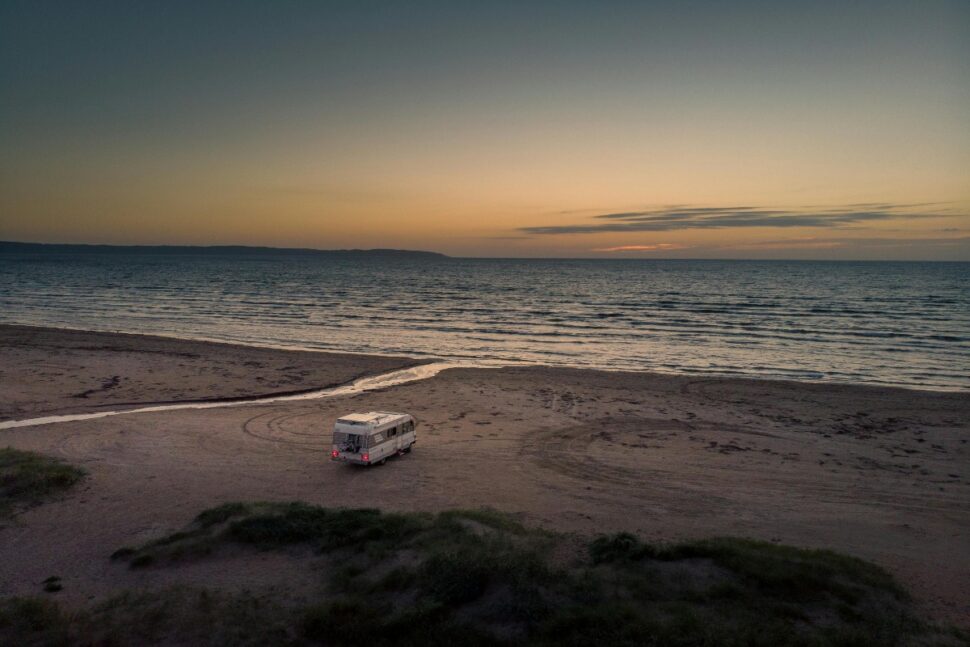 RV on Beach at Sunset