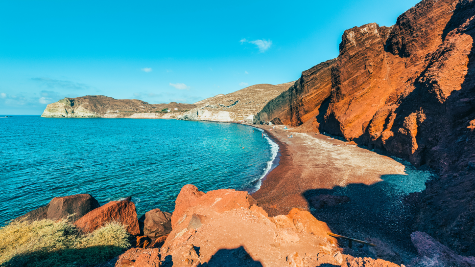 Red Beach Santorini surrounded by red rocks and know as one of the World's most shocking nude beaches 