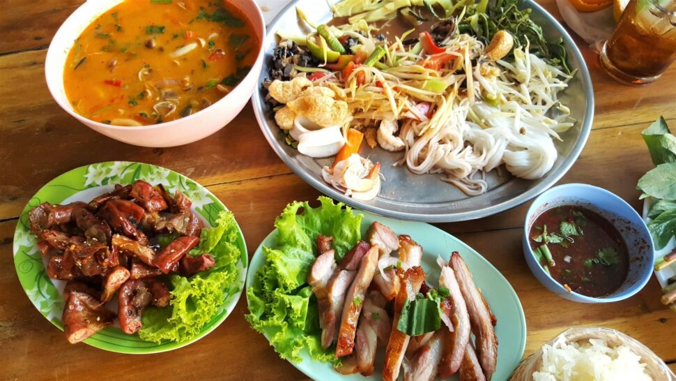 Varying meat, soup and rice dishes with lettuce from Thailand