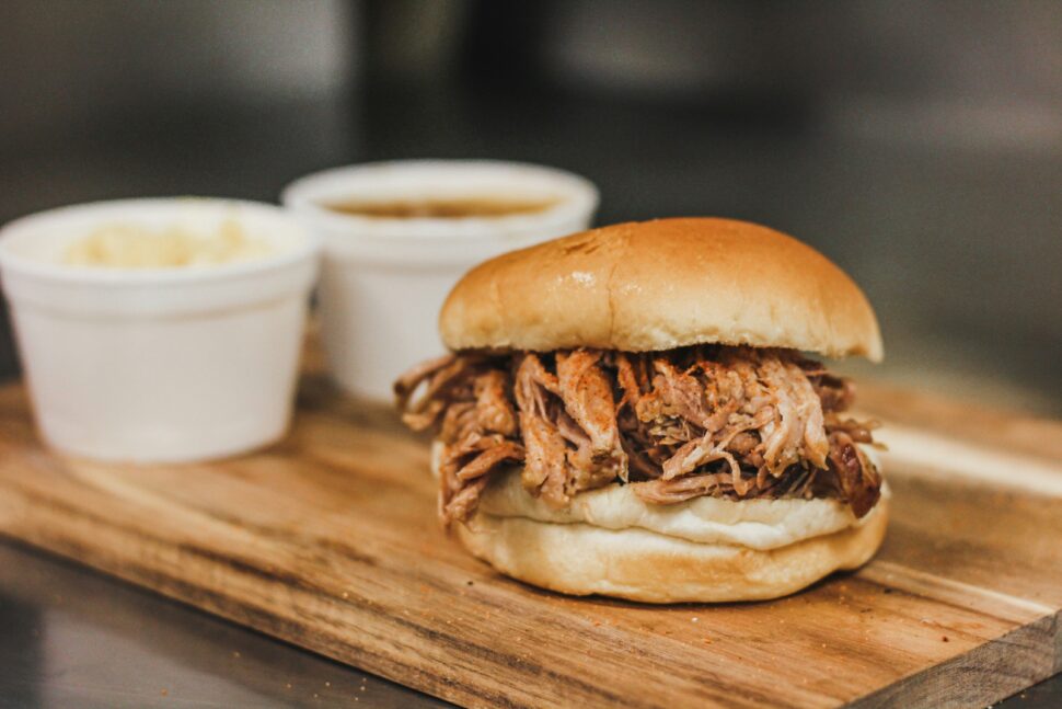 Pulled Pork Sandwich on Brown wooden plate 