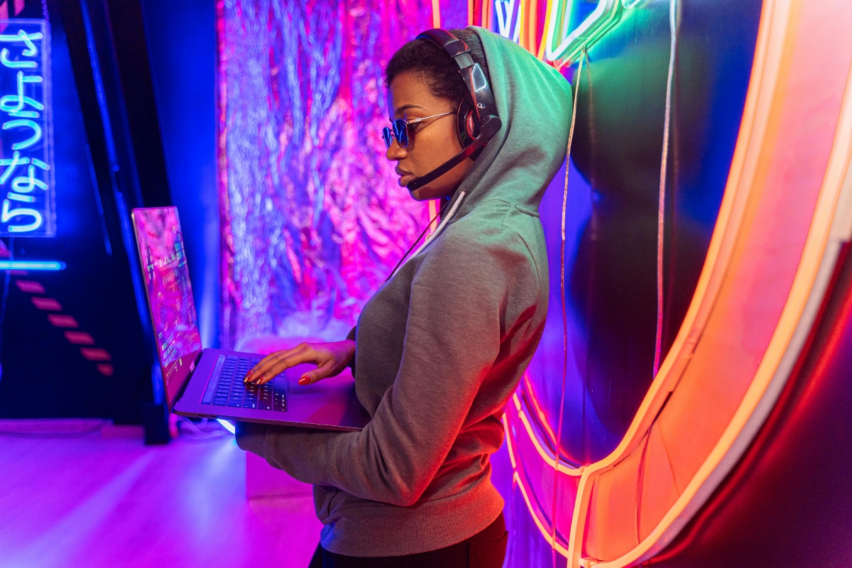 woman in Gray Hoodie Using Black Laptop Computer