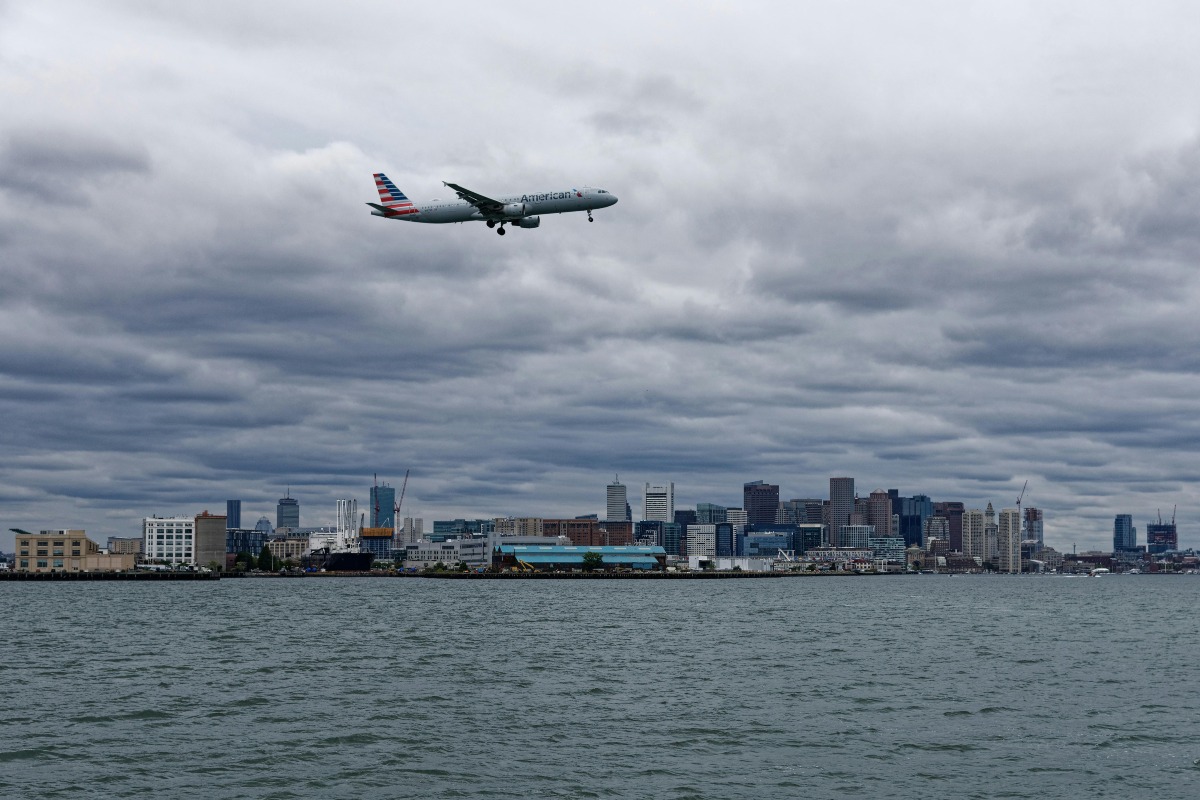 Passenger Plane Flying over a Body of Water