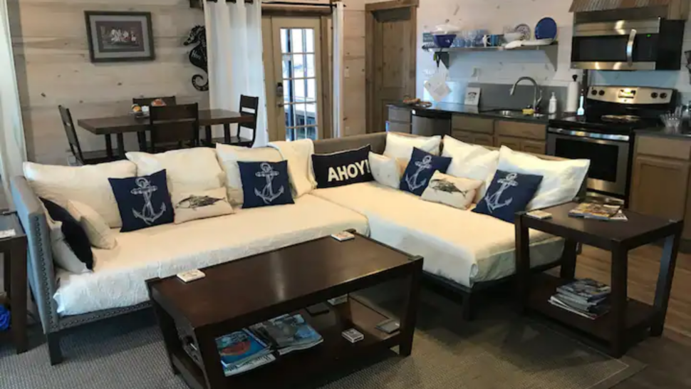 View of living room and kitchen at the Slip Away Marina Waterfront Floating Home in Louisiana