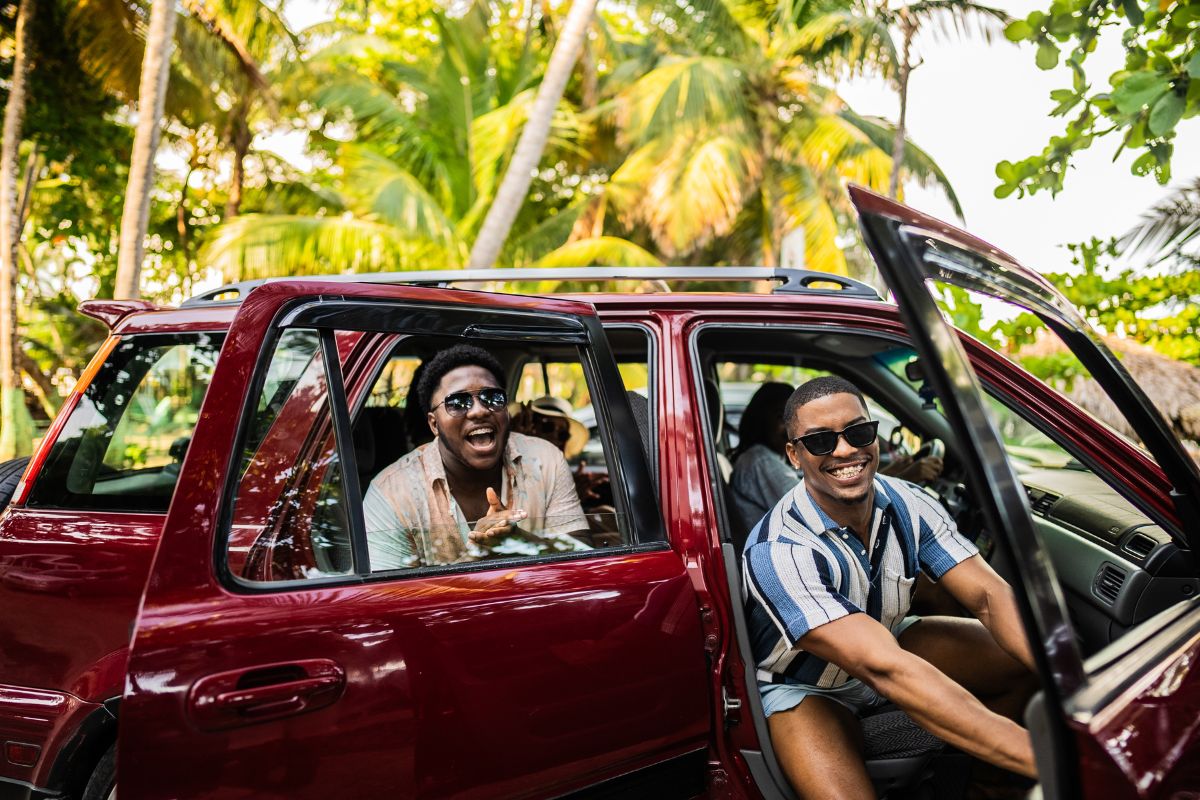 male friends getting out of a car