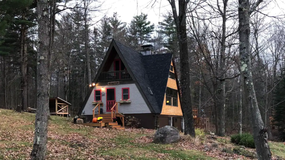 Outdoor fall view of the Adirondack Mountainside A-Frame Airbnb in New York