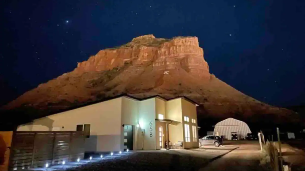 Zoomed out view of the New Red Dirt Life Airbnb with large mountain in background in Utah