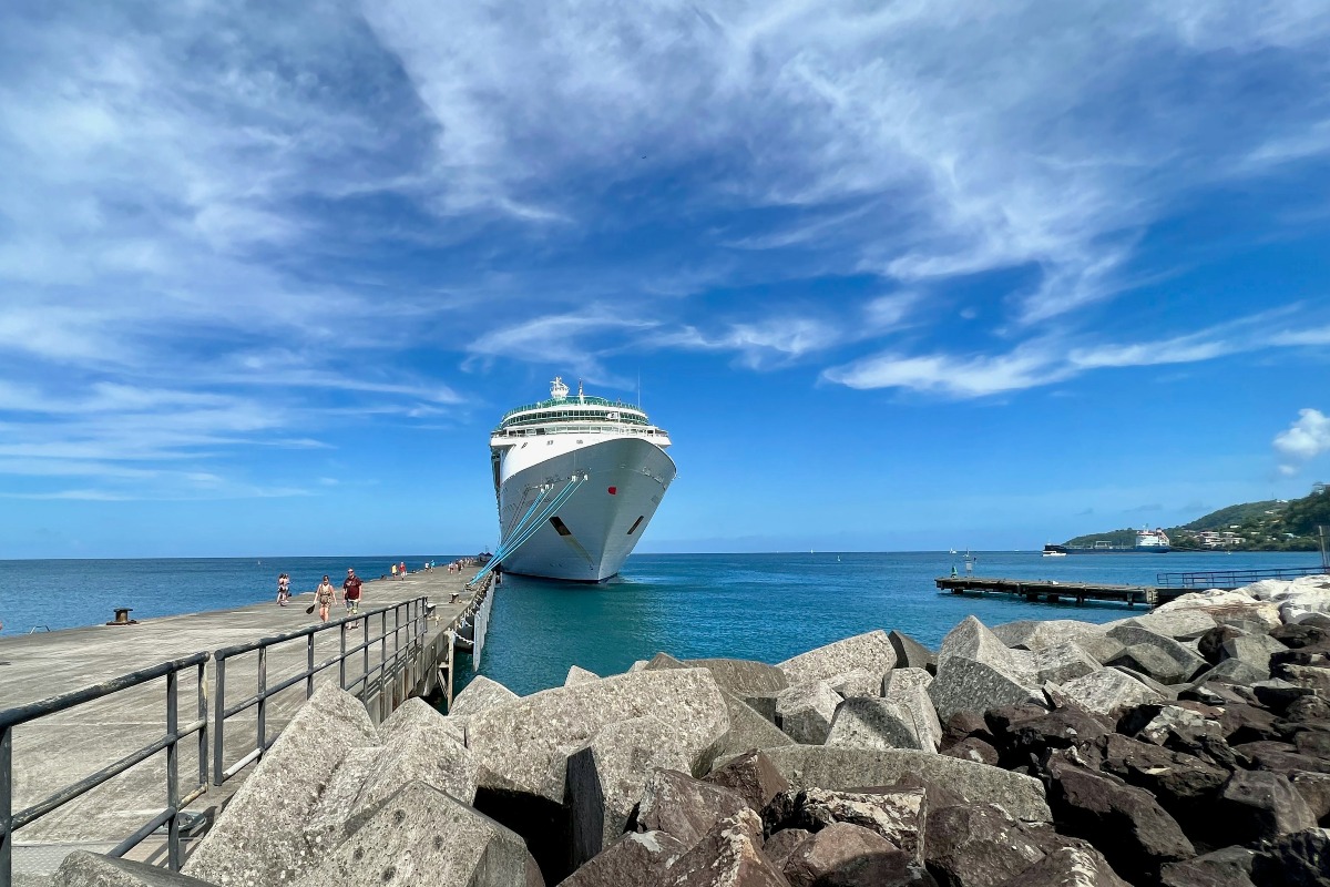 a cruise ship docked at a pier