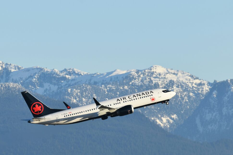 Air Canada airplane in flight, the flag carrier and largest airline in Canada.