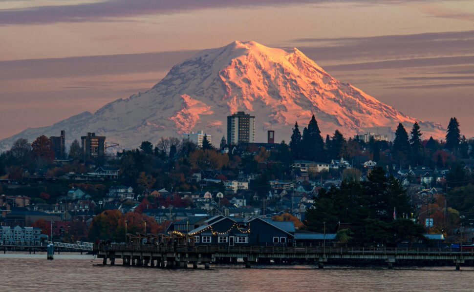 a view of Tacoma skyline with mountains and buildings 