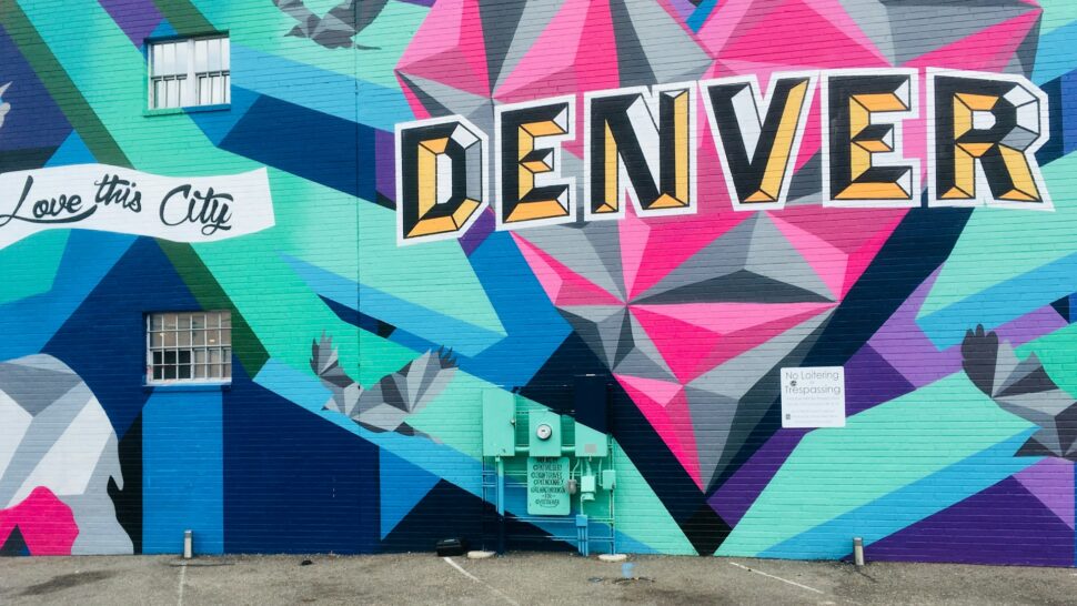 Graffiti of "Denver" and "Love This City" on a Colorado building