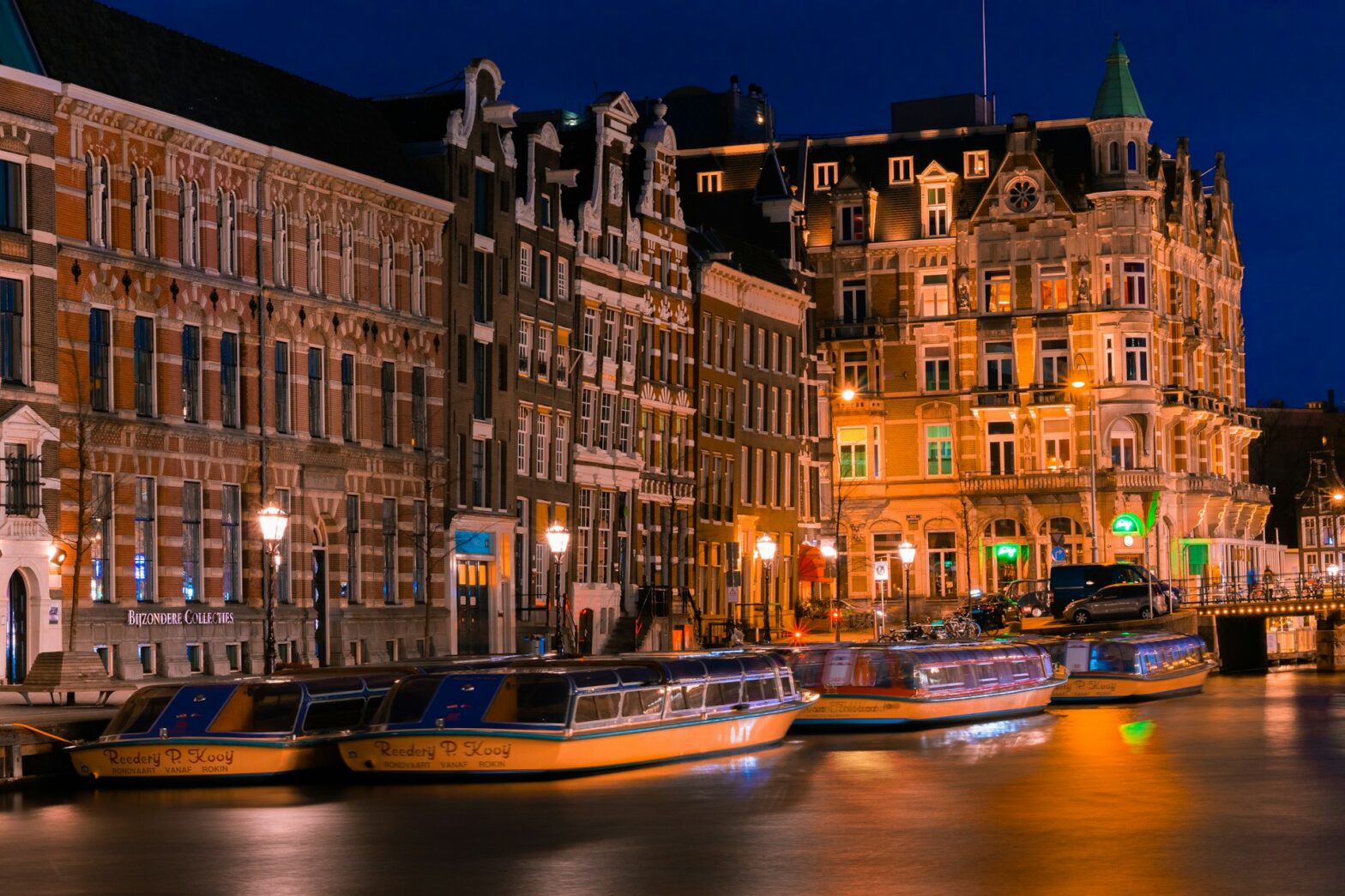 Boats line up along buildings in Amsterdam, Netherlands