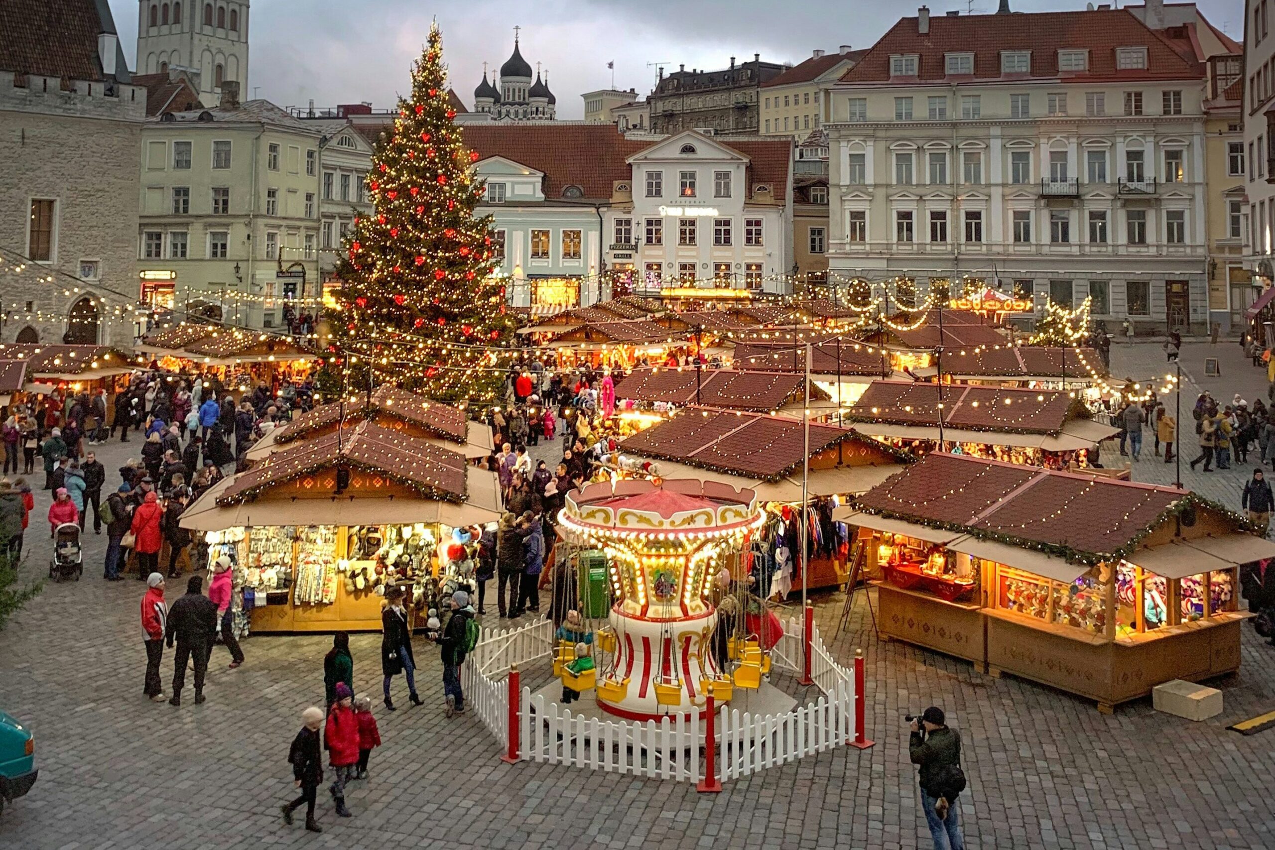 A Christmas Market in Estonia, where shops are decorated with festive lights. 