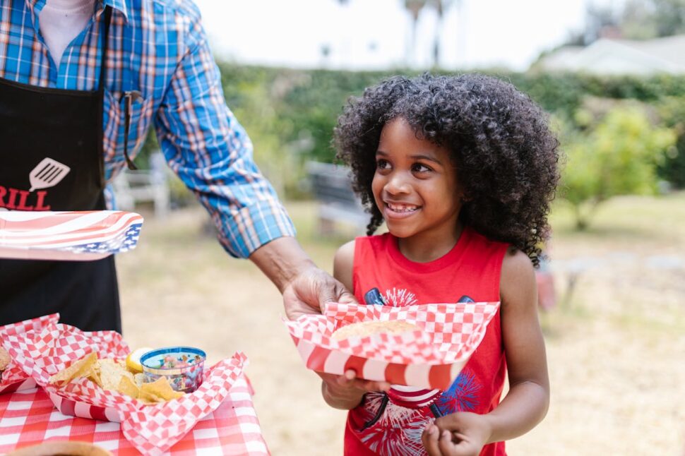 Curly haired girl wearing patriotic T-shirt