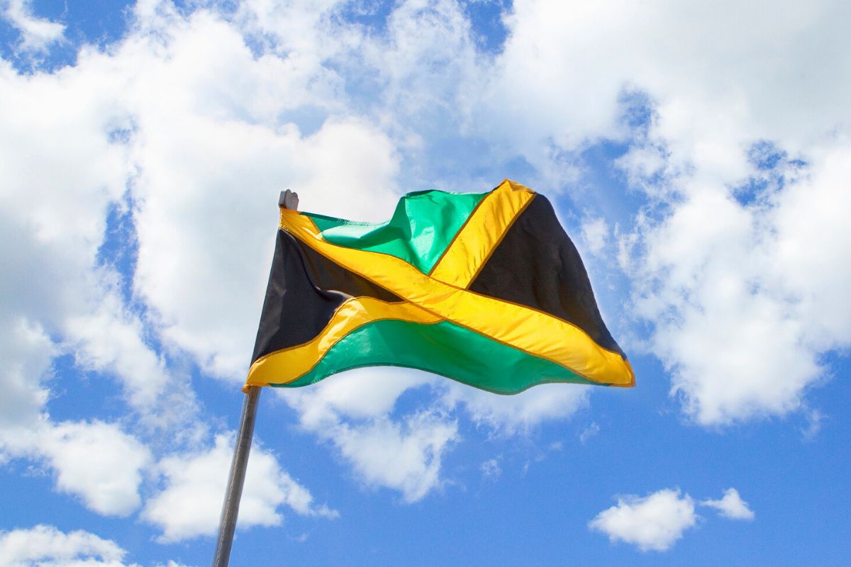 Jamaican flag waving with blue sky