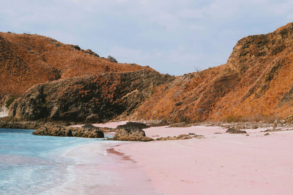 Pink Sand Beach on Komodo Island, where red coral fragments mix with white sand to create a stunning pink shoreline.