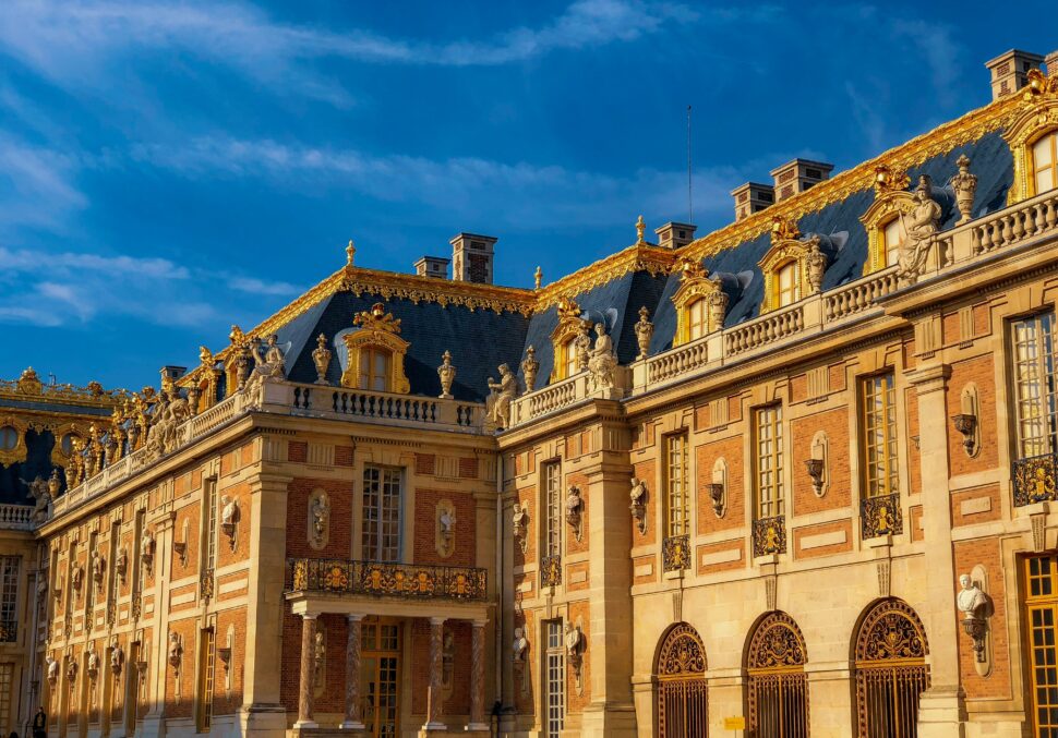 The Palace of Versailles with its grand architecture and sprawling gardens, located just outside Paris