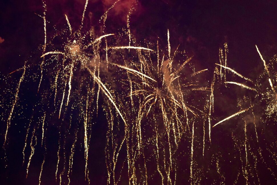 New Year in Edinburgh, Scotland (Hogmanay) is celebrated with fireworks and festive cheer.