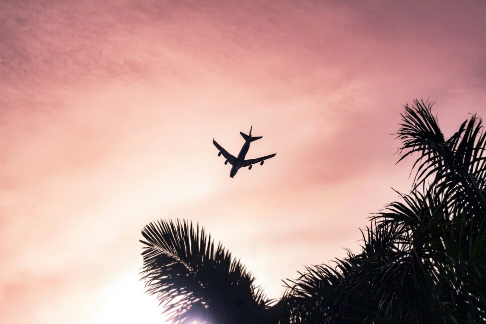 An airplane soaring high above the clouds, symbolizing high-flying humor and puns that take your laughter to new heights.