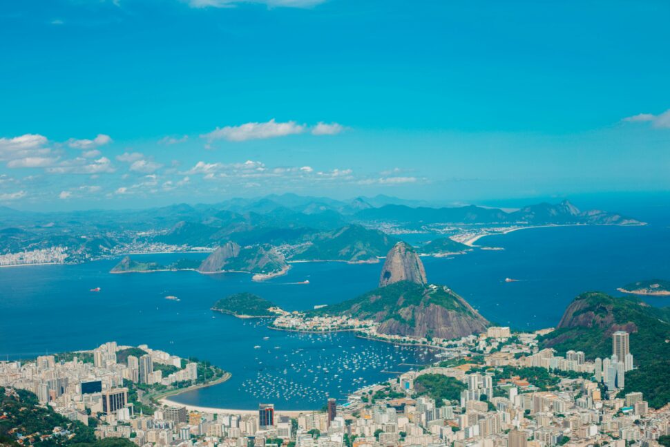 Distant view of Rio De Janeiro cityscape and water.