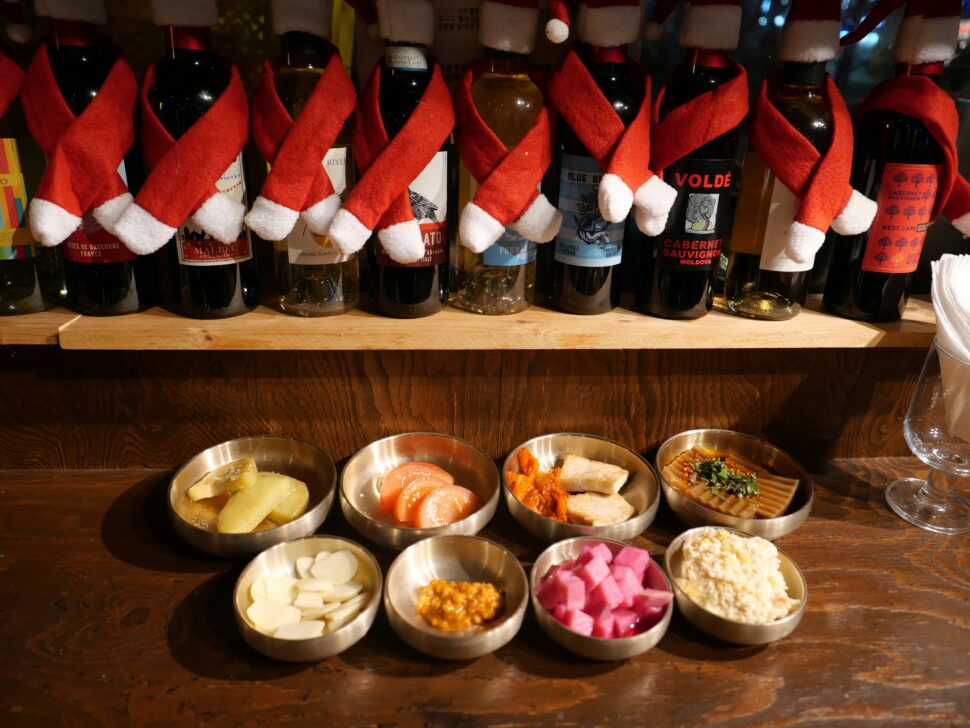 Array of korean food served in small bowls during the holiday season.