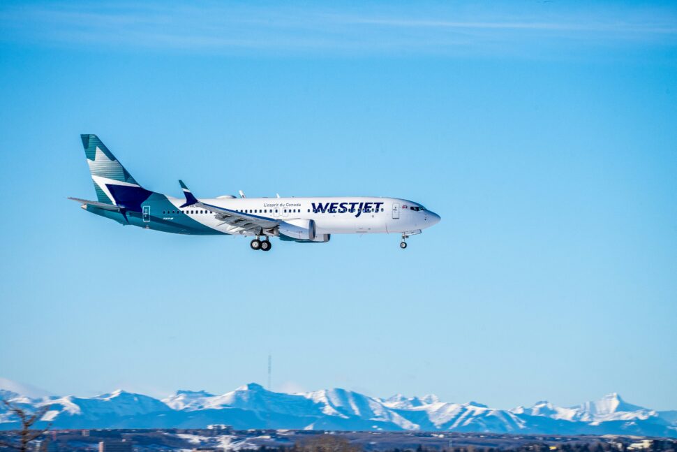 WestJet Aircraft in flight and landing