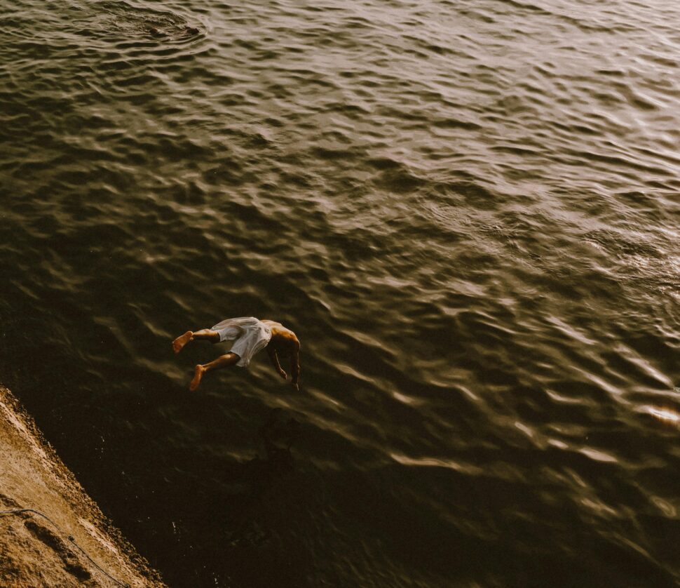 man jumping into water