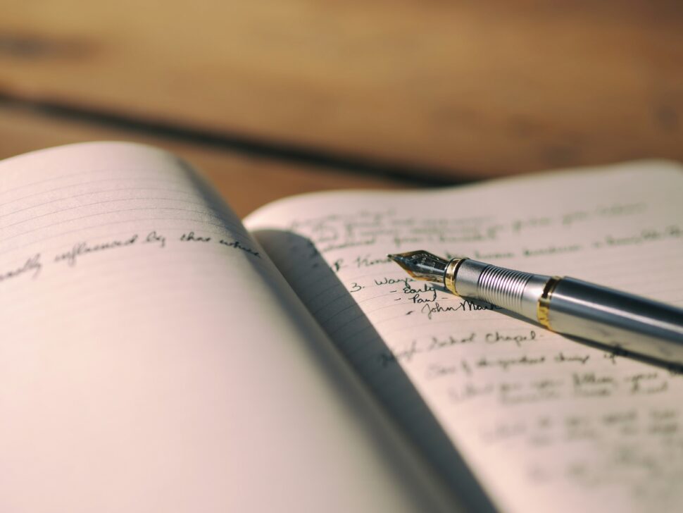 A journal and pen depicting reflection during a trip.