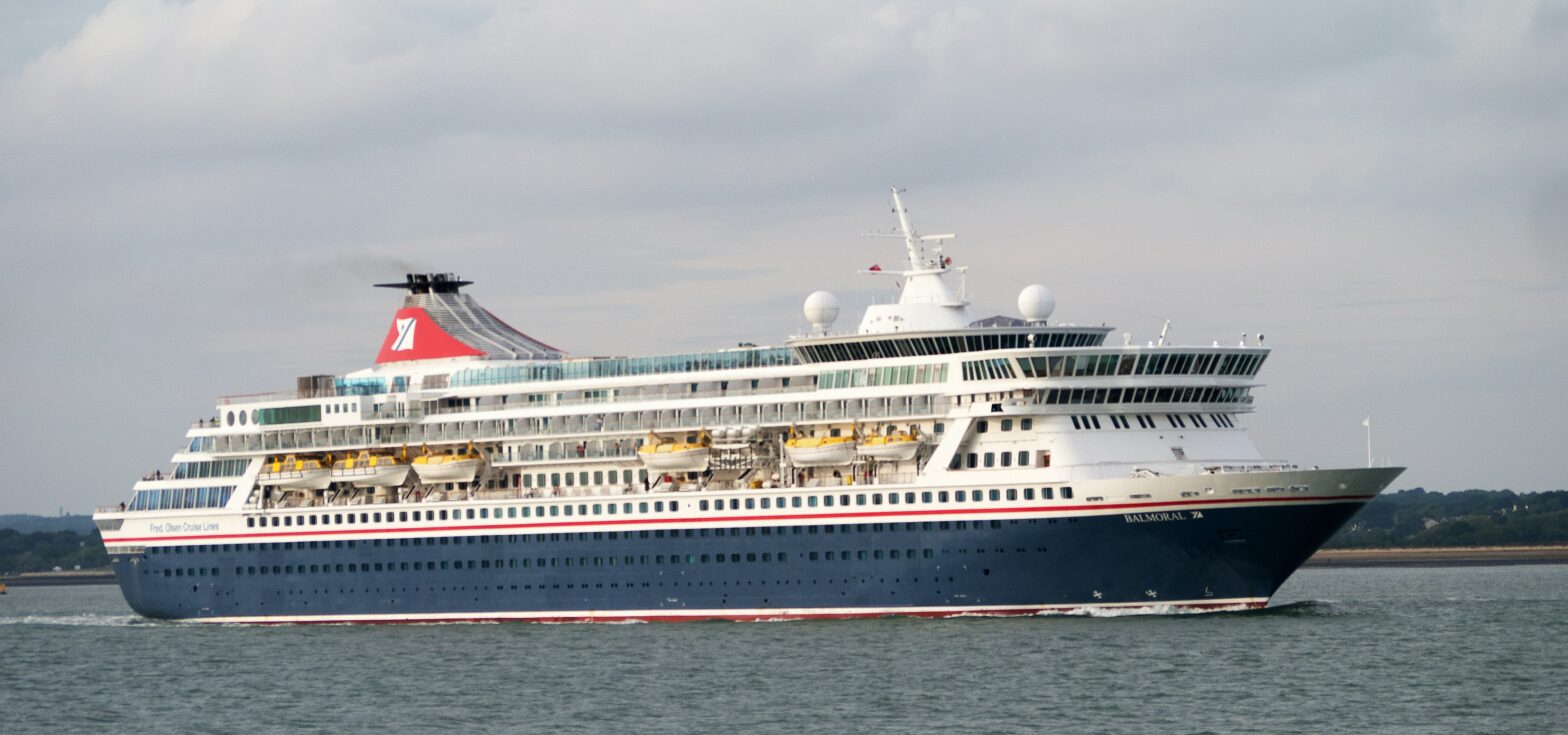 Cruise ship on the open waters with passengers on board.