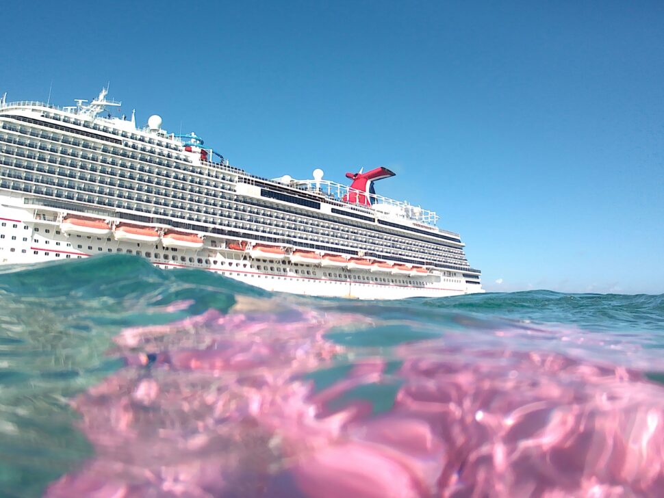 A majestic cruise ship amidst gentle waves as it flounders about the water.