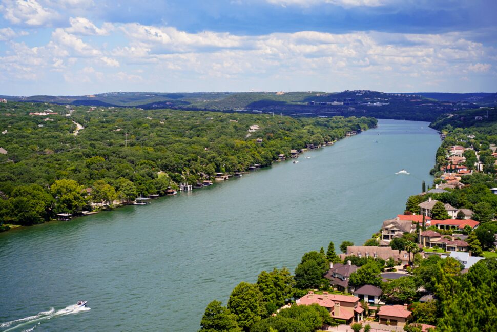 Aerial view of Austin, Texas lake and homes during the warm month of January.