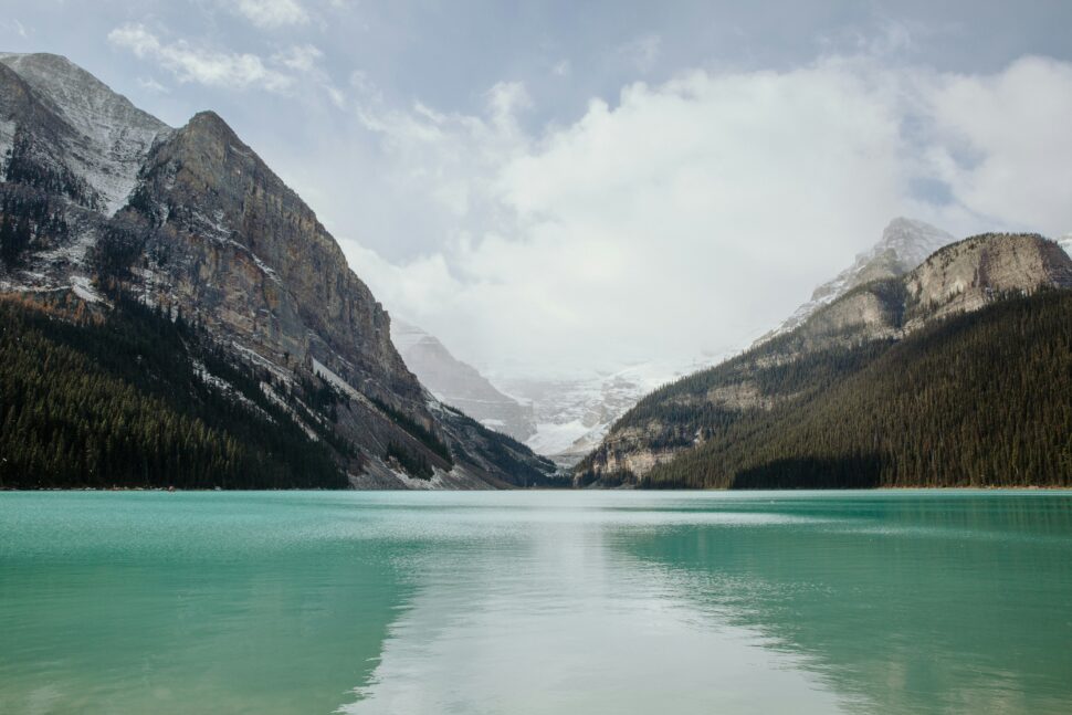 Water with mountains in the distance during the winter season. 