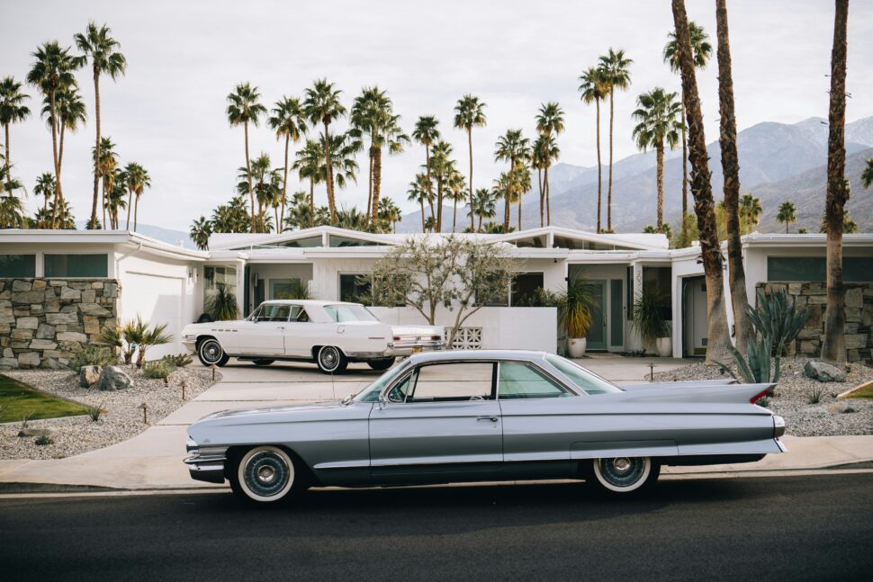 A car parked in front of a driveway in Palm Springs, California.