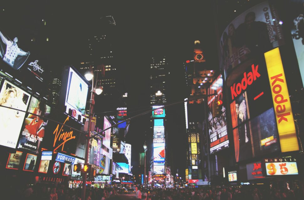 New York City Times Square, illuminated at night, showcasing the bustling energy of the city.