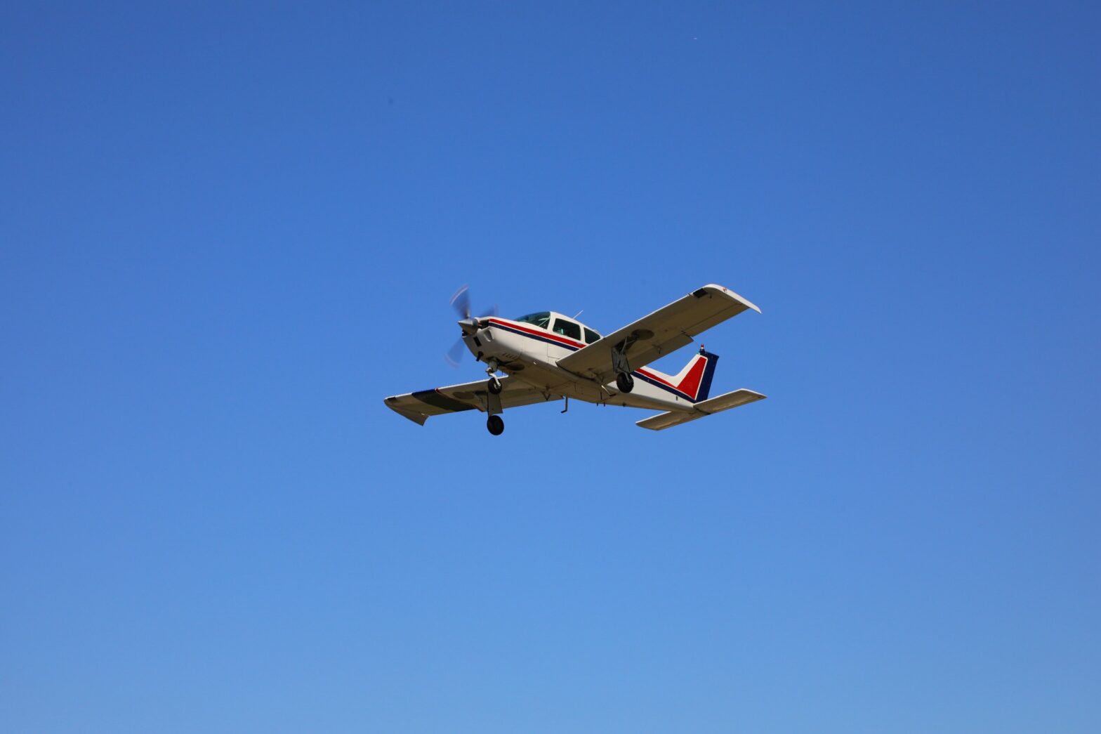 Small aircraft in a clear sky.