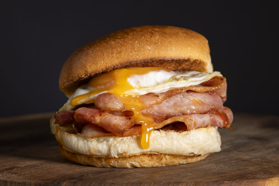 Bacon and egg on a soft white bread roll.