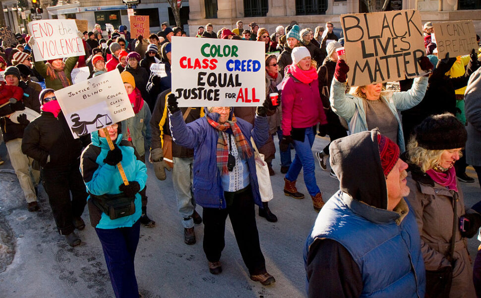 People march from Congress Square, down Congress Street, to protest  recent police violence around the country, on Sunday, December 7, 2014.