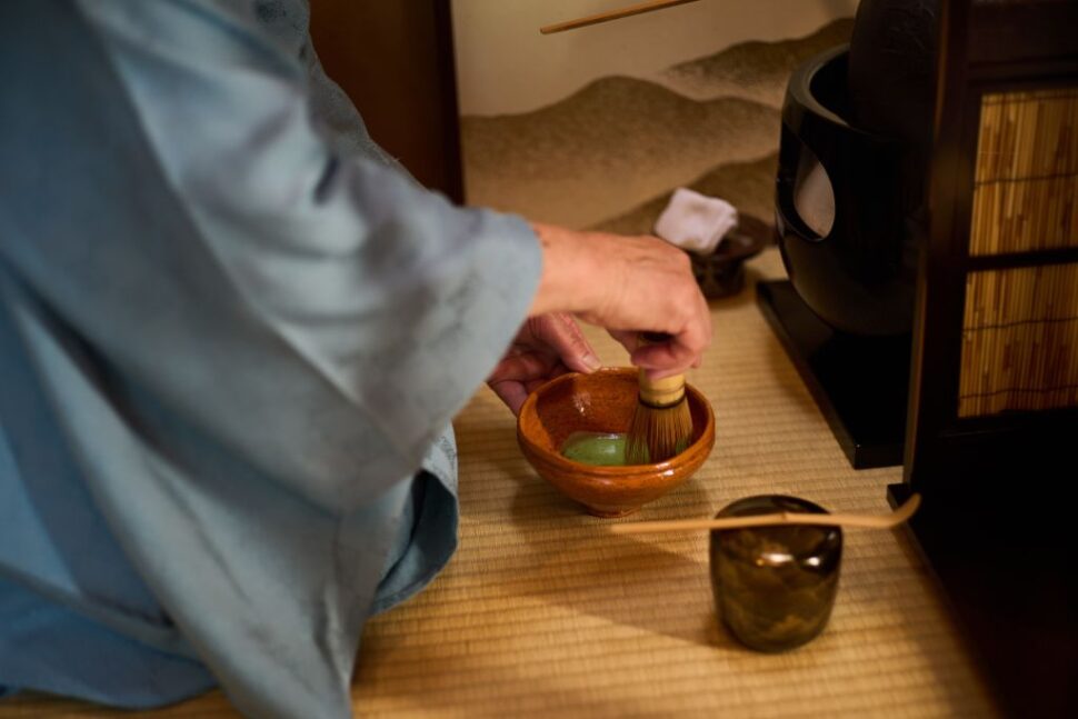 Tea Master Asami Yaeko demonstrates the brewing of matcha in the tea ceremony room at her home in Saitama, Japan, on June 10, 2023.  Matcha is a tea drink originated in China. Kentoushi, or diplomats to China's Tang Dynasty 618-907, brought matcha back to Japan during the 9th century, where it became popular as time went by. Unlike regular teas, matcha needs to be ground before brewing and serving.  Tea Master Asami Yaeko, who is near her 80, has been in touch with tea ceremony since childhood under the influence of her grandmother, and has been involved in tea for a lifetime. She demonstrated a tea ceremony with macha at her home in Saitama on Saturday. (Photo by Zhang Xiaoyu/Xinhua via Getty Images)