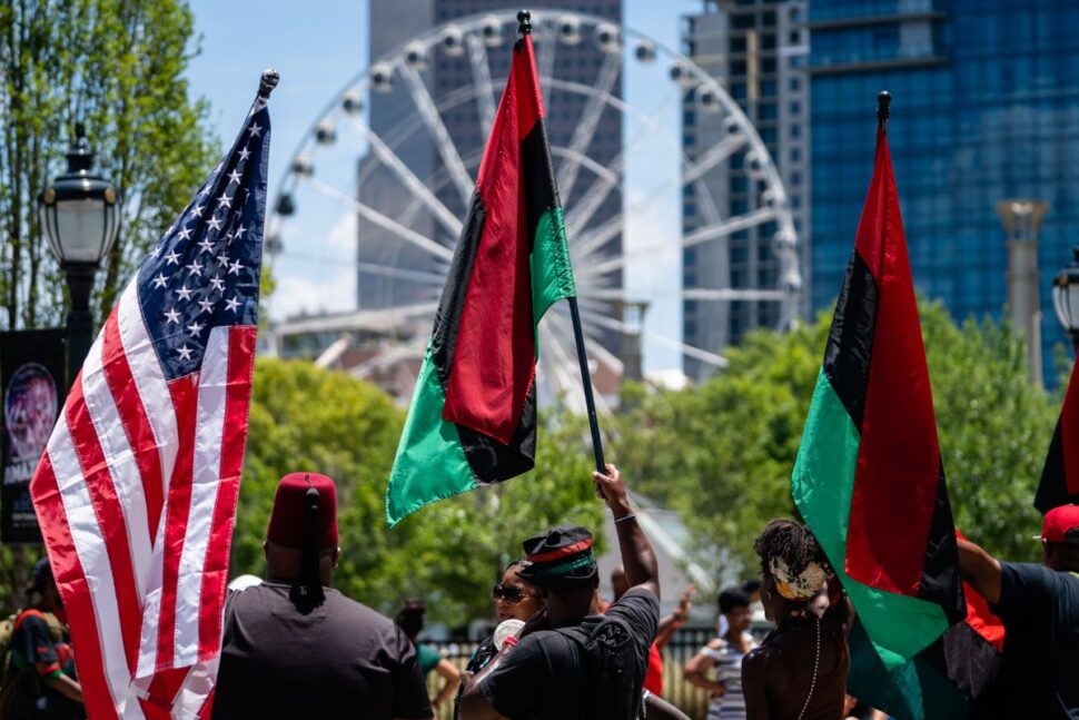 people holding flags on Juneteenth