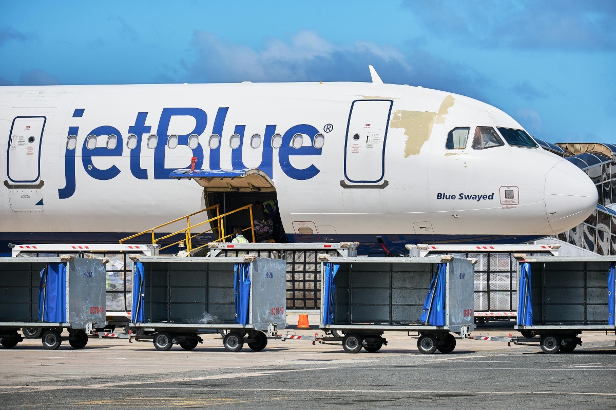 Woman's Plane Blessing Ritual Goes Viral, Sparking Debate Among Travelers