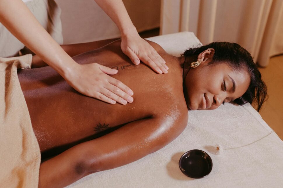 Woman Lying on a Massage Table and Getting a Massage. 
