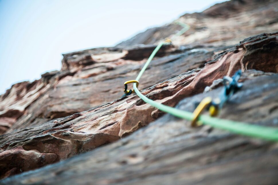 Rock climbing rope leading up to the peak for a mountain.