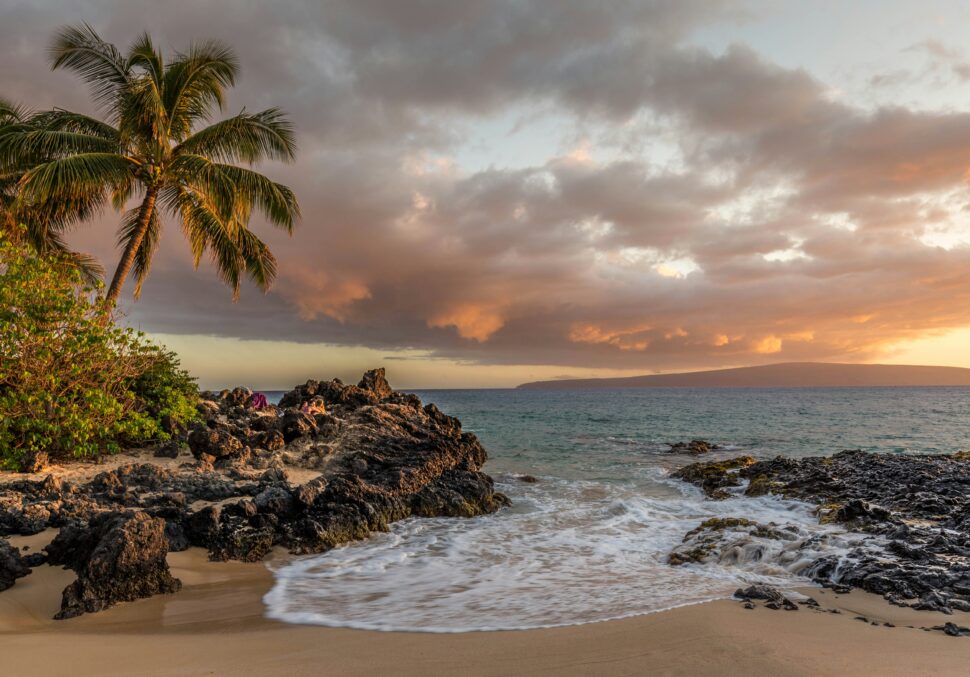 Hawaiin beach during sunset for travelers seeking nature.